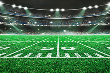 50 yard line on a football field surrounded by charts and graphs
