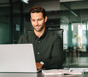 Businessman using AI tools on a laptop