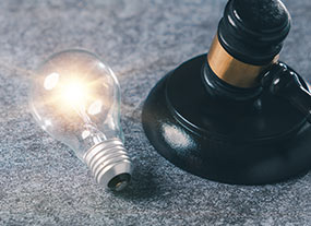 Lightbulb next to gavel