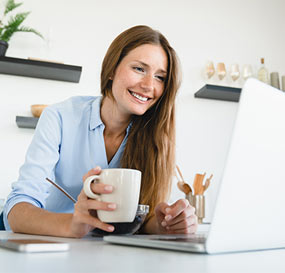 Woman watching and listening to Legislative Digest Live on her laptop